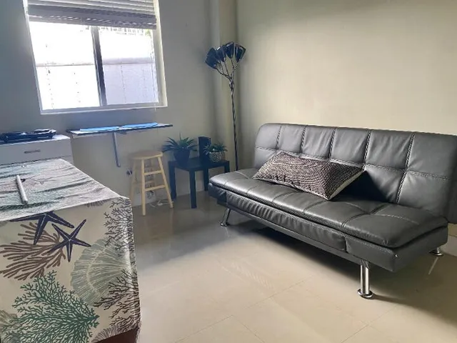 a living room with furniture and a window