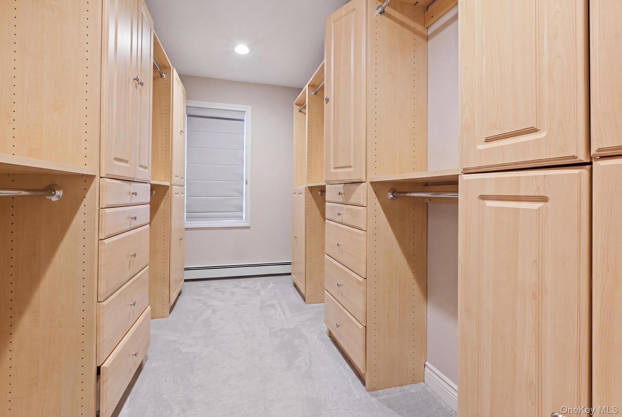 19 Sunset Road West Albertson, NY 11507 - Photo 12 of 24 Custom closet system featuring light wood cabinetry