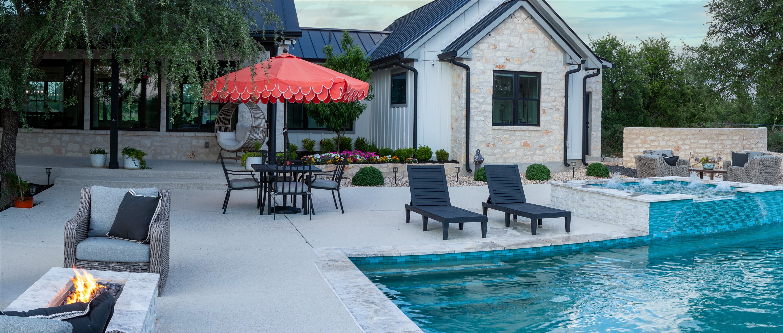 272 Slate Rock Road Fredericksburg, TX 78624 - Photo 5 of 32 Backyard pool and decking area provides ample entertaining space.