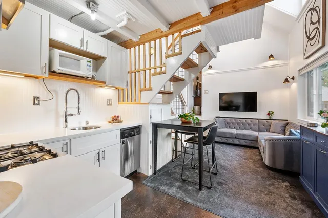 a stove top oven sitting inside of a kitchen