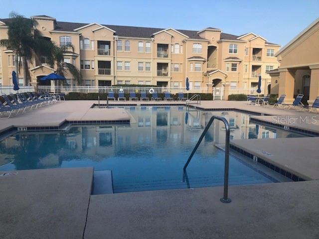 120 Terrace Ridge Circle, Unit 120 Davenport, FL 33896 - Photo 8 of 11 a large building with a view of swimming pool