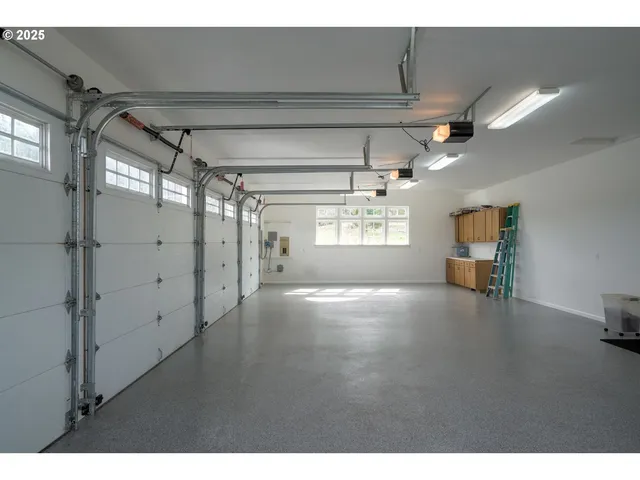 a view of a patio with chair and tables