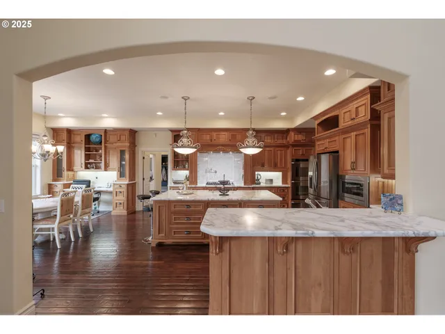 a kitchen with counter top space cabinets and furniture
