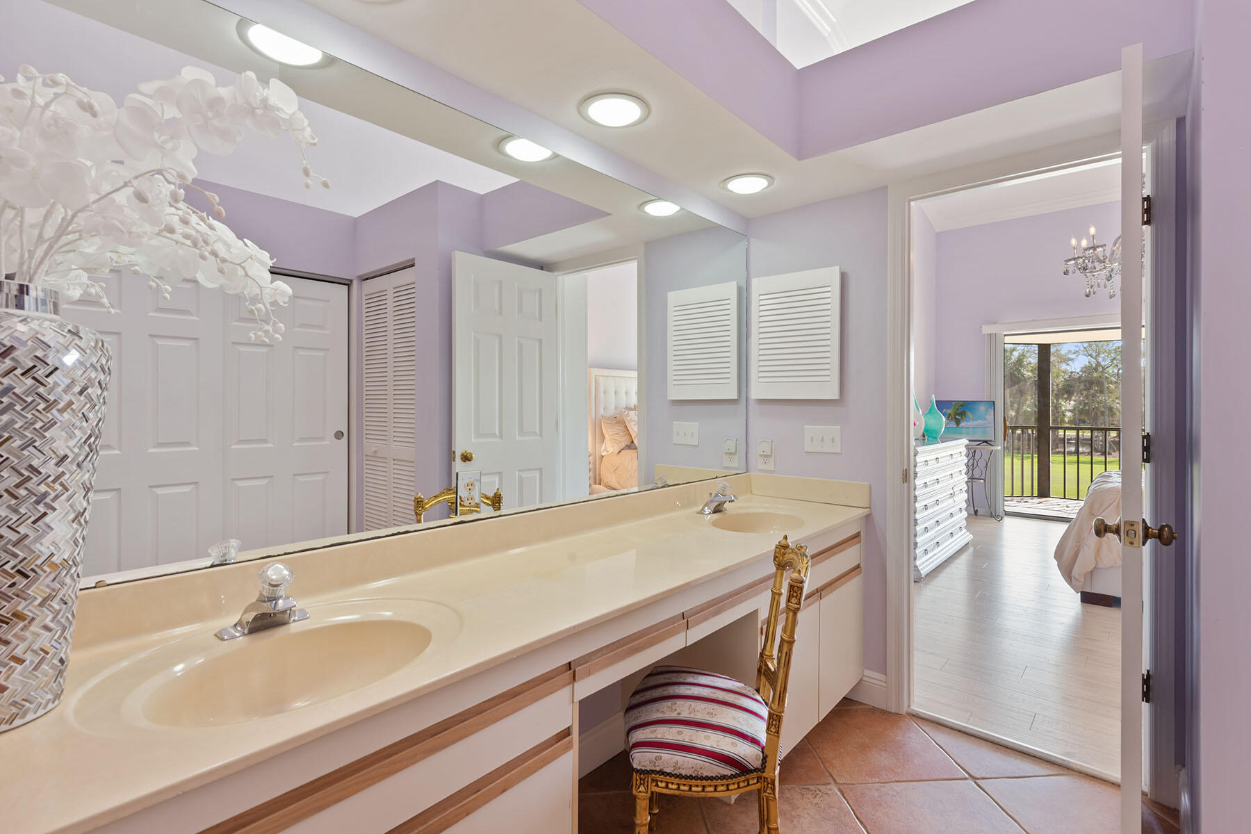 792 Eagle Creek Drive, Unit 204 Naples, FL 34113 - Photo 11 of 49 a spacious bathroom with a sink a large mirror and a shower