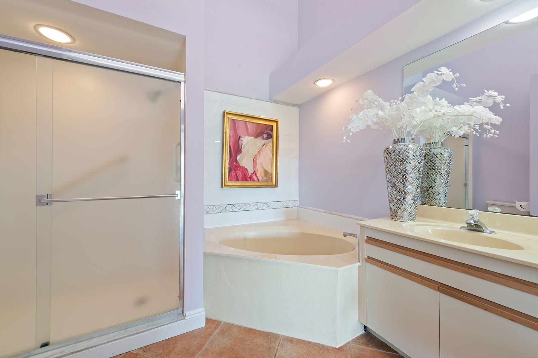 792 Eagle Creek Drive, Unit 204 Naples, FL 34113 - Photo 12 of 49 a bathroom with a sink a bathtub and a mirror