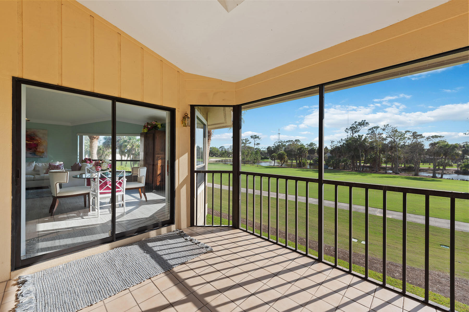 792 Eagle Creek Drive, Unit 204 Naples, FL 34113 - Photo 16 of 49 a balcony with view of an outdoor space