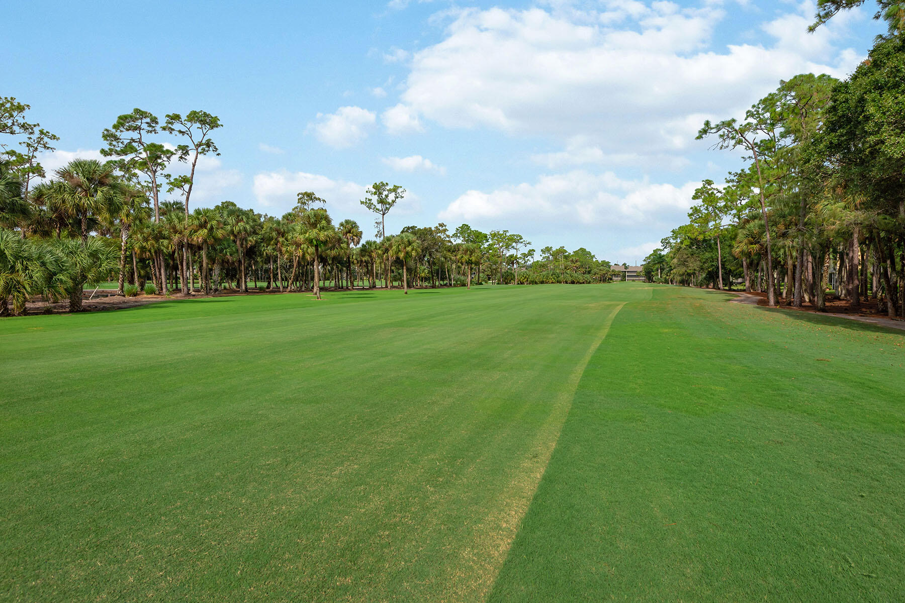 792 Eagle Creek Drive, Unit 204 Naples, FL 34113 - Photo 19 of 49 a view of a golf course with a lake