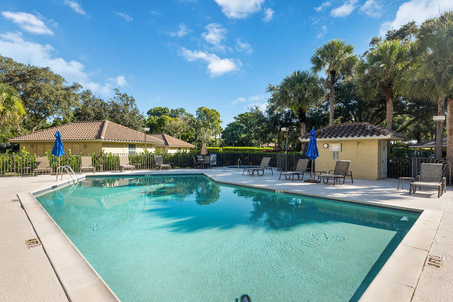 792 Eagle Creek Drive, Unit 204 Naples, FL 34113 - Photo 20 of 49 a swimming pool with outdoor seating and yard