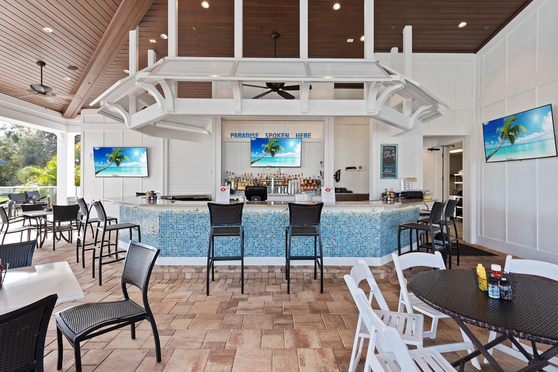 792 Eagle Creek Drive, Unit 204 Naples, FL 34113 - Photo 24 of 49 a view of a dining room with furniture