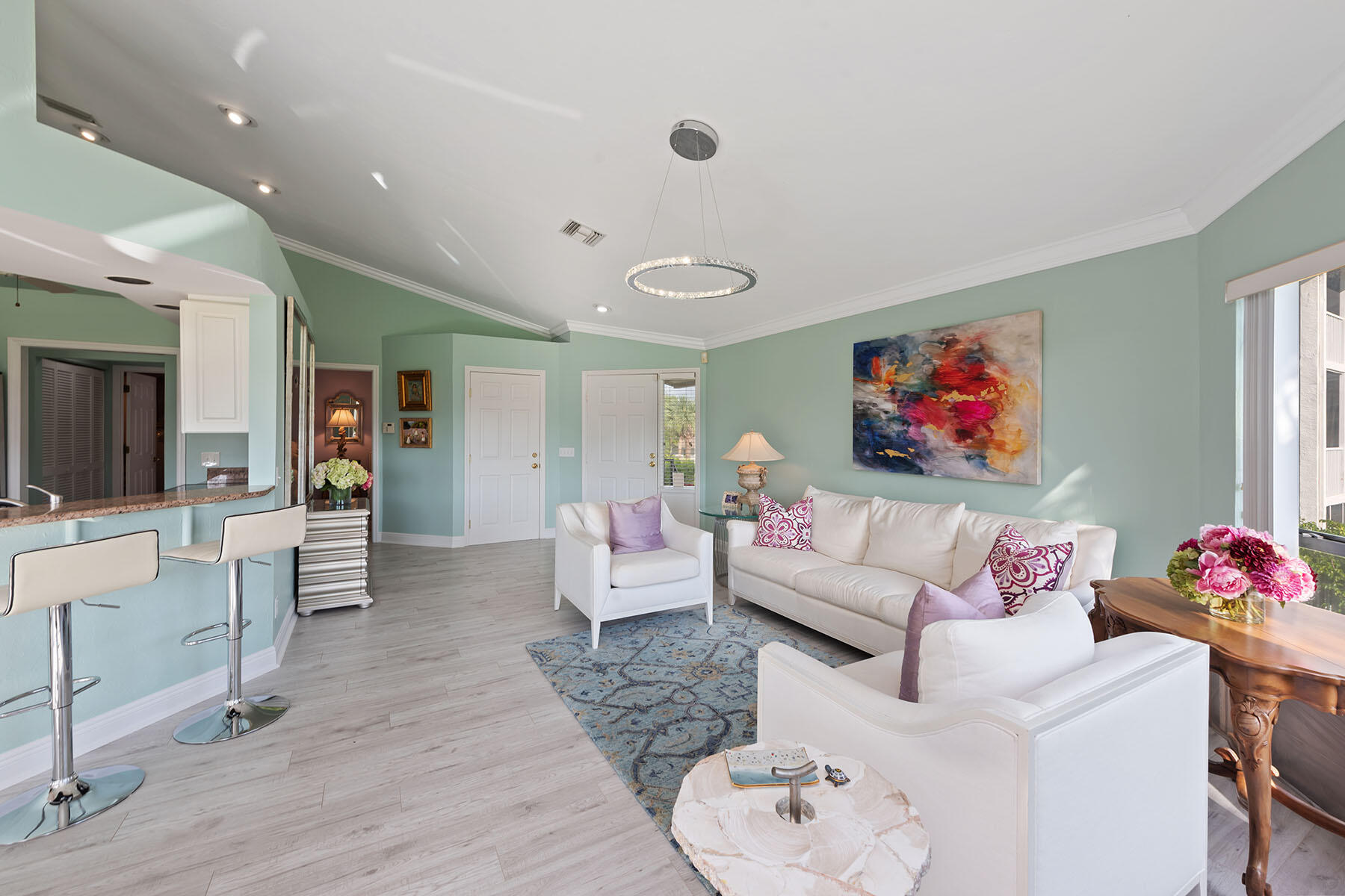 792 Eagle Creek Drive, Unit 204 Naples, FL 34113 - Photo 3 of 49 a living room with furniture and a flat screen tv