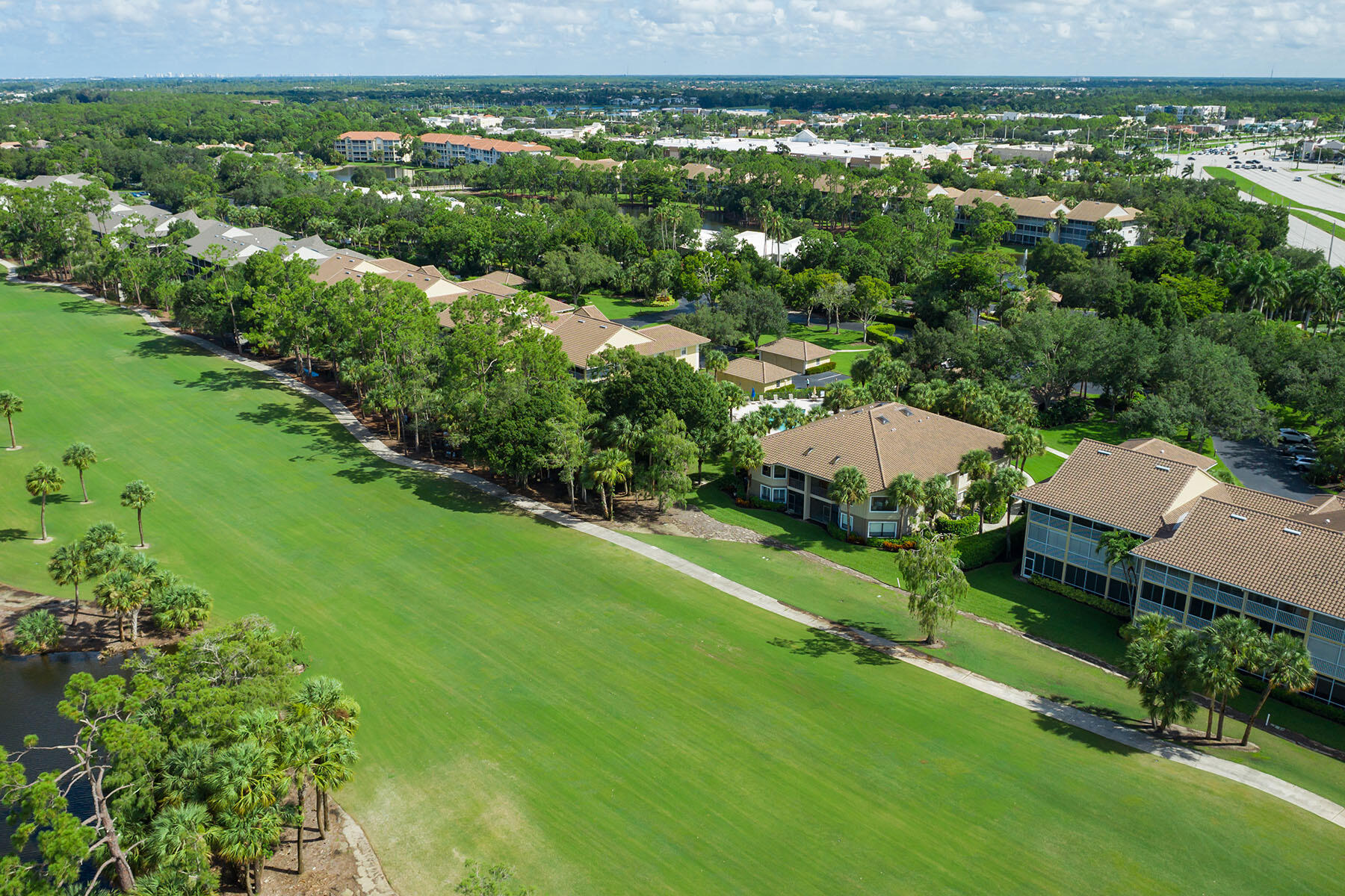 792 Eagle Creek Drive, Unit 204 Naples, FL 34113 - Photo 34 of 49 an aerial view of residential houses with outdoor space and trees