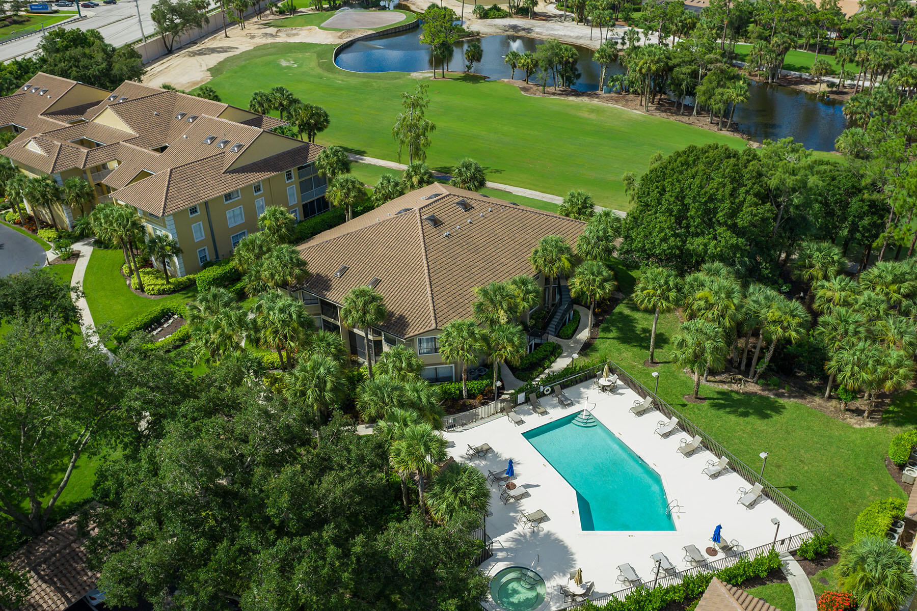 792 Eagle Creek Drive, Unit 204 Naples, FL 34113 - Photo 36 of 49 an aerial view of a house with a yard and outdoor seating