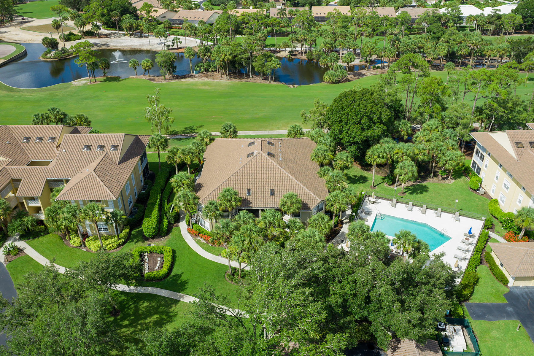 792 Eagle Creek Drive, Unit 204 Naples, FL 34113 - Photo 37 of 49 an aerial view of a house with a yard