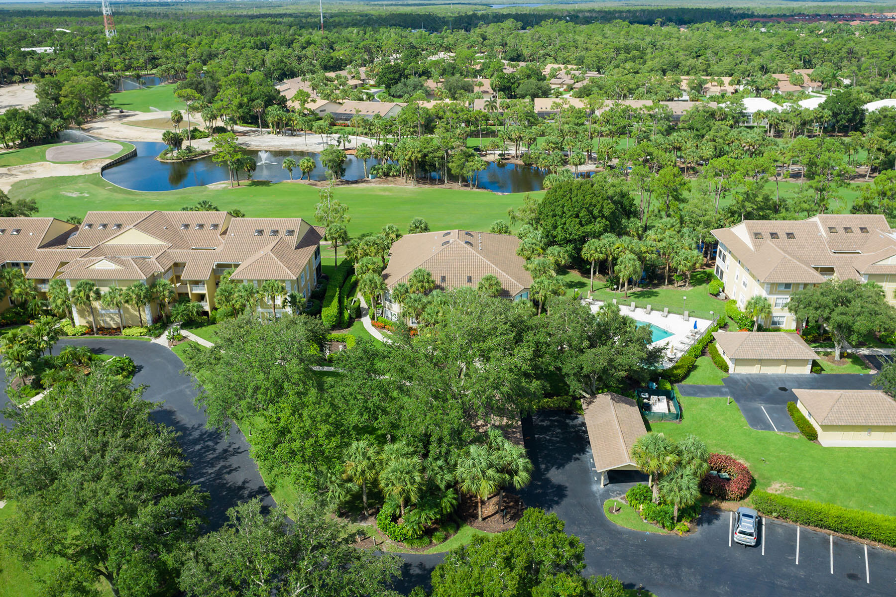 792 Eagle Creek Drive, Unit 204 Naples, FL 34113 - Photo 38 of 49 an aerial view of a city with lots of residential buildings