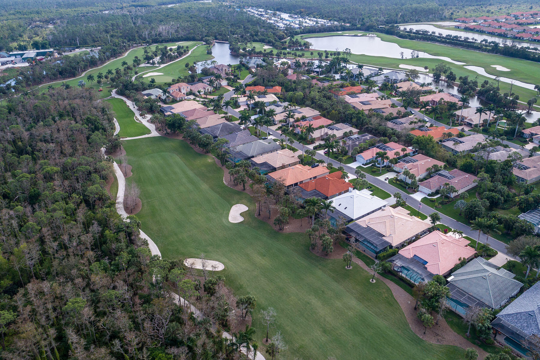 792 Eagle Creek Drive, Unit 204 Naples, FL 34113 - Photo 42 of 49 an aerial view of a residential houses with outdoor space and street view