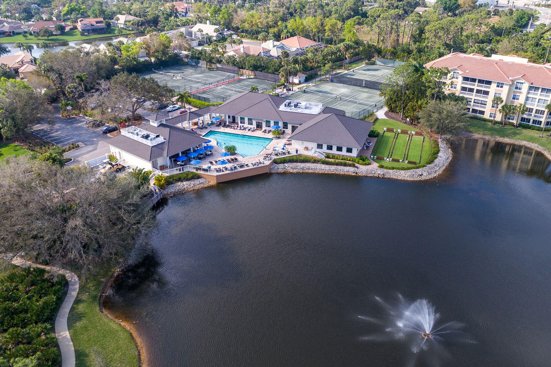 792 Eagle Creek Drive, Unit 204 Naples, FL 34113 - Photo 47 of 49 an aerial view of residential houses with outdoor space and swimming pool