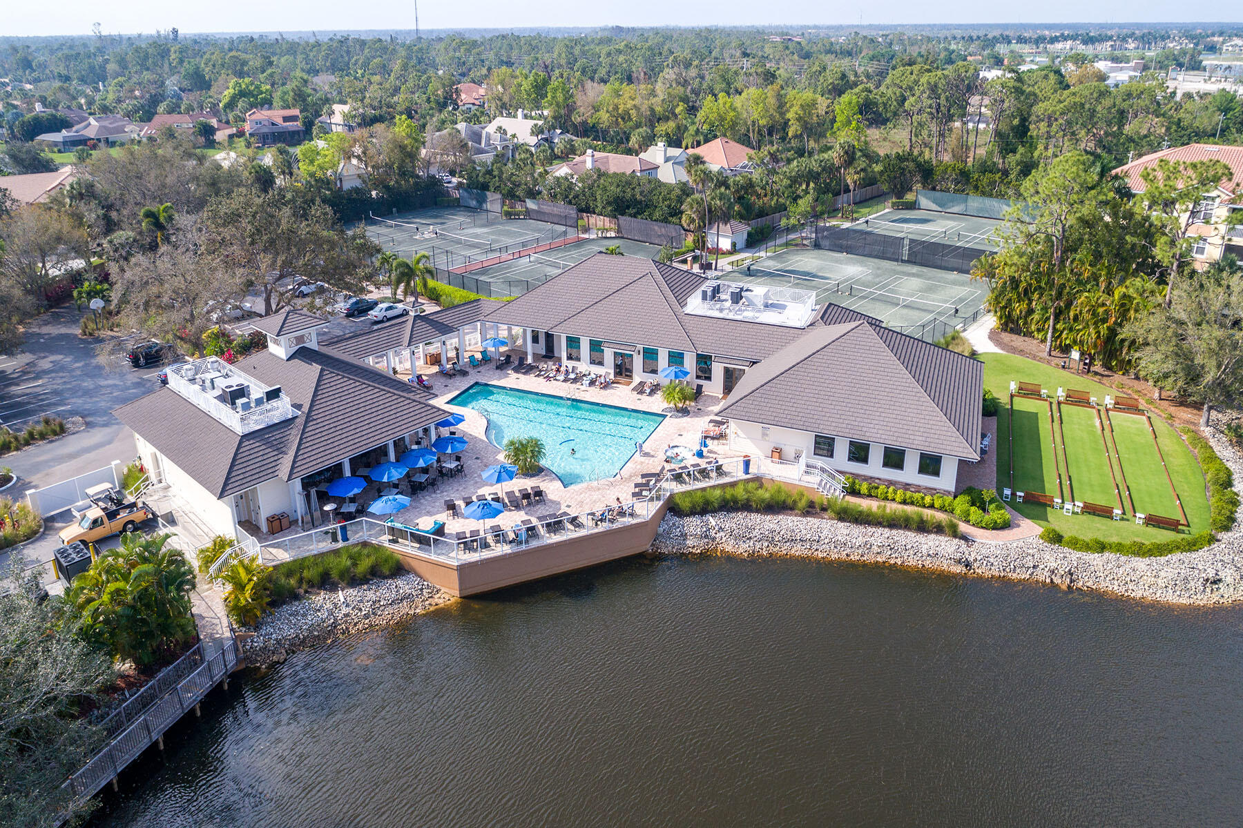 792 Eagle Creek Drive, Unit 204 Naples, FL 34113 - Photo 48 of 49 an aerial view of a house with a garden and lake view