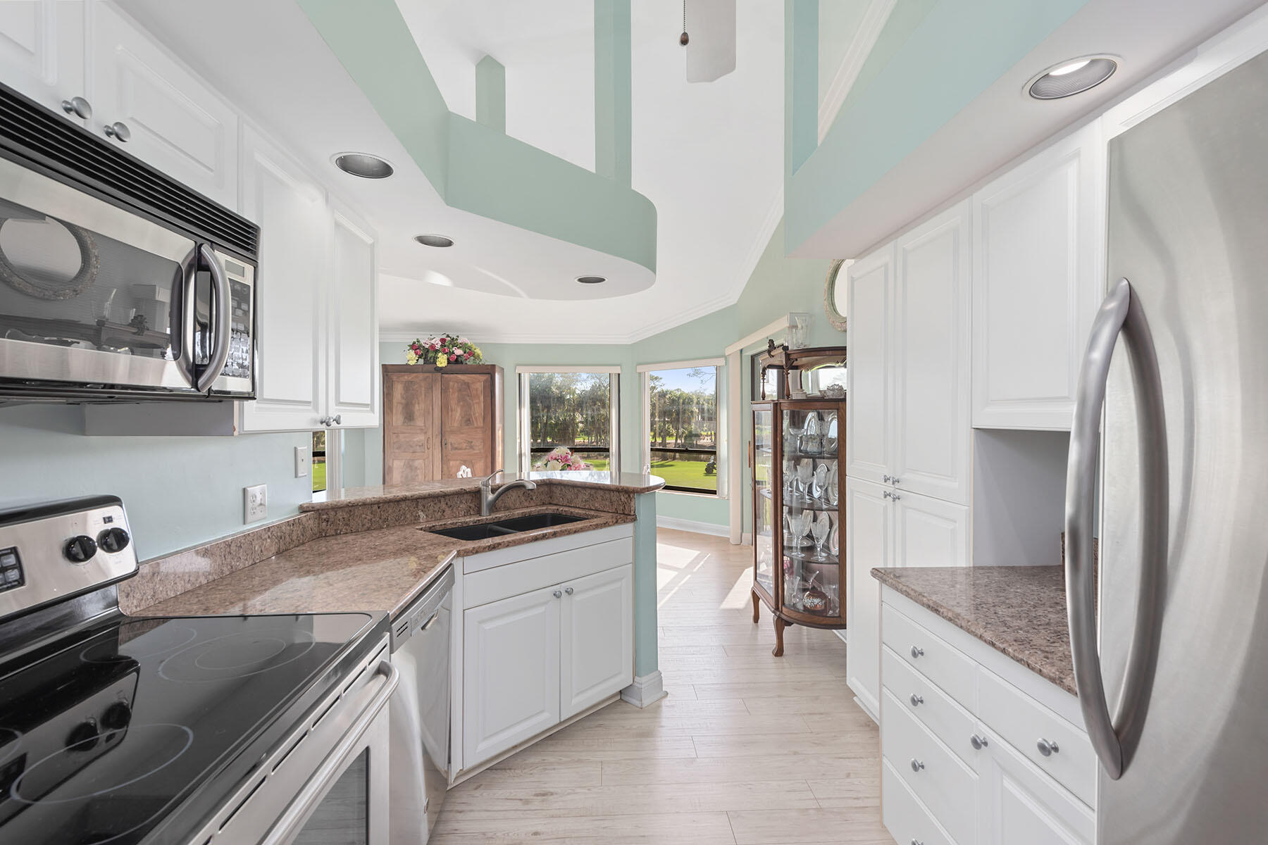 792 Eagle Creek Drive, Unit 204 Naples, FL 34113 - Photo 6 of 49 a kitchen with a sink stove and refrigerator