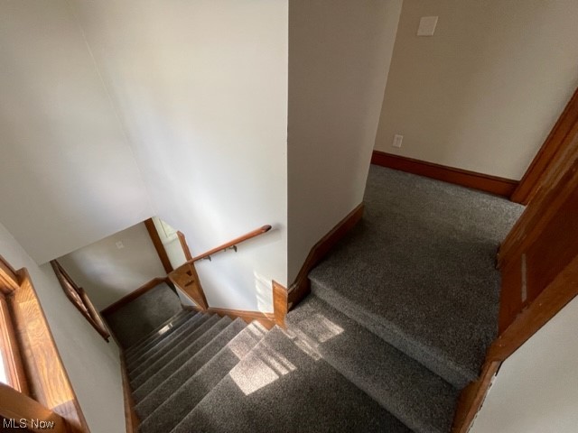 997 Berwin Street Akron, OH 44310 - Photo 26 of 34 Stairway featuring dark carpet
