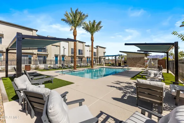 a view of a patio with swimming pool table and chairs