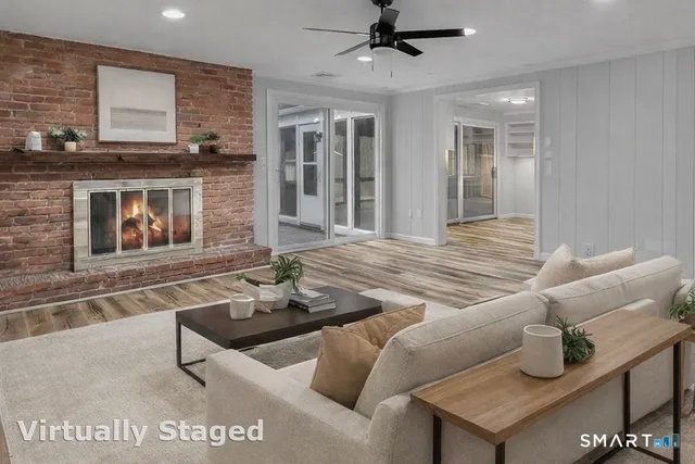 a living room with furniture and a fireplace