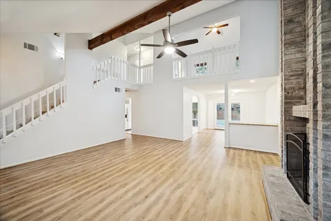 a view of a kitchen with wooden floor