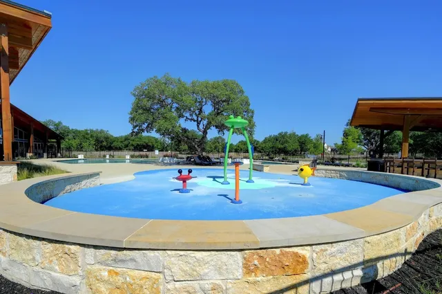a view of a swimming pool with a patio