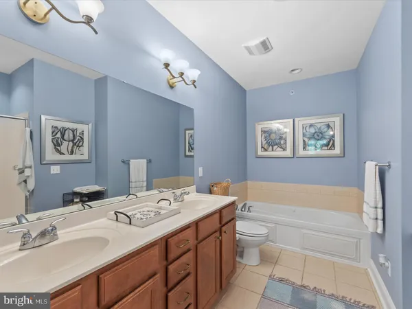 a bathroom with a bathtub and shower
