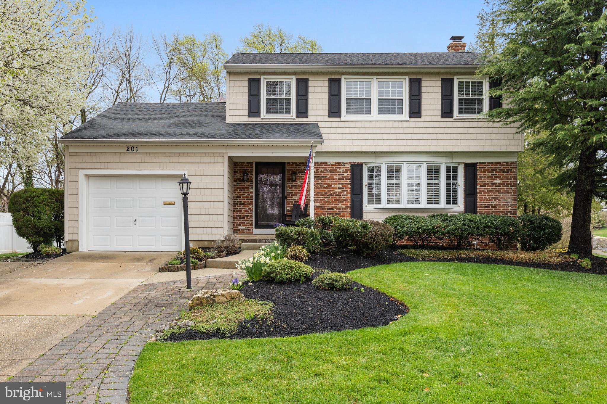 201 Hamilton Road Marlton, NJ 08053 - Photo 1 of 50 a front view of a house with a yard and garage