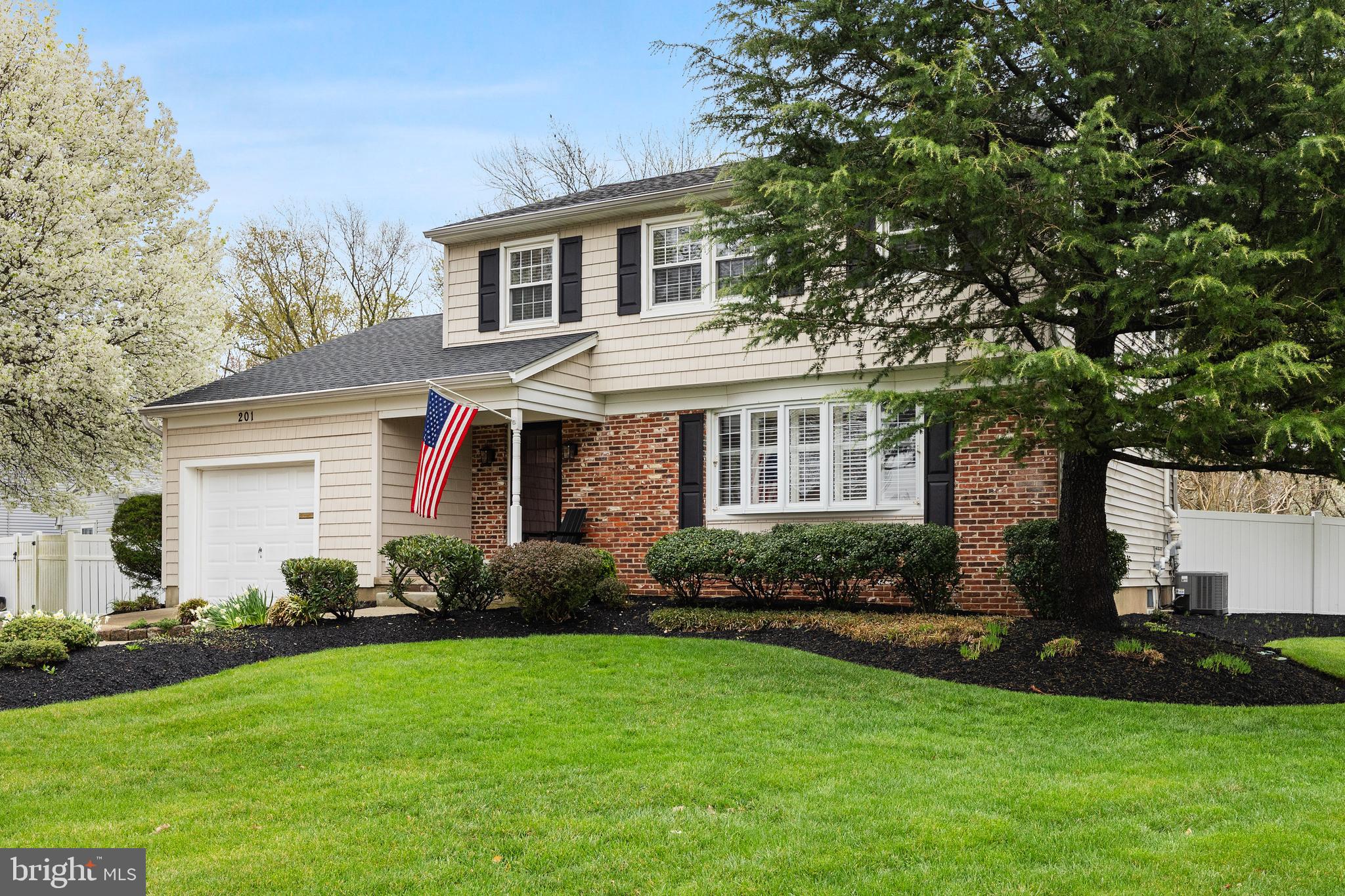 201 Hamilton Road Marlton, NJ 08053 - Photo 2 of 50 a front view of a house with a garden and plants