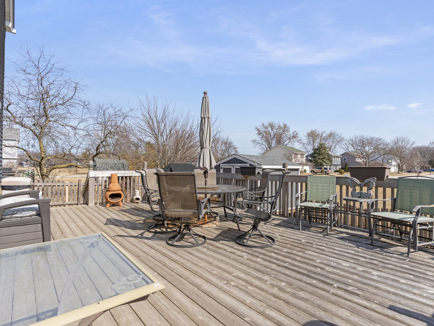 1400 Bar Harbour Road Aurora, IL 60504 - Photo 15 of 25 a view of a rooftop deck with chairs and wooden floor