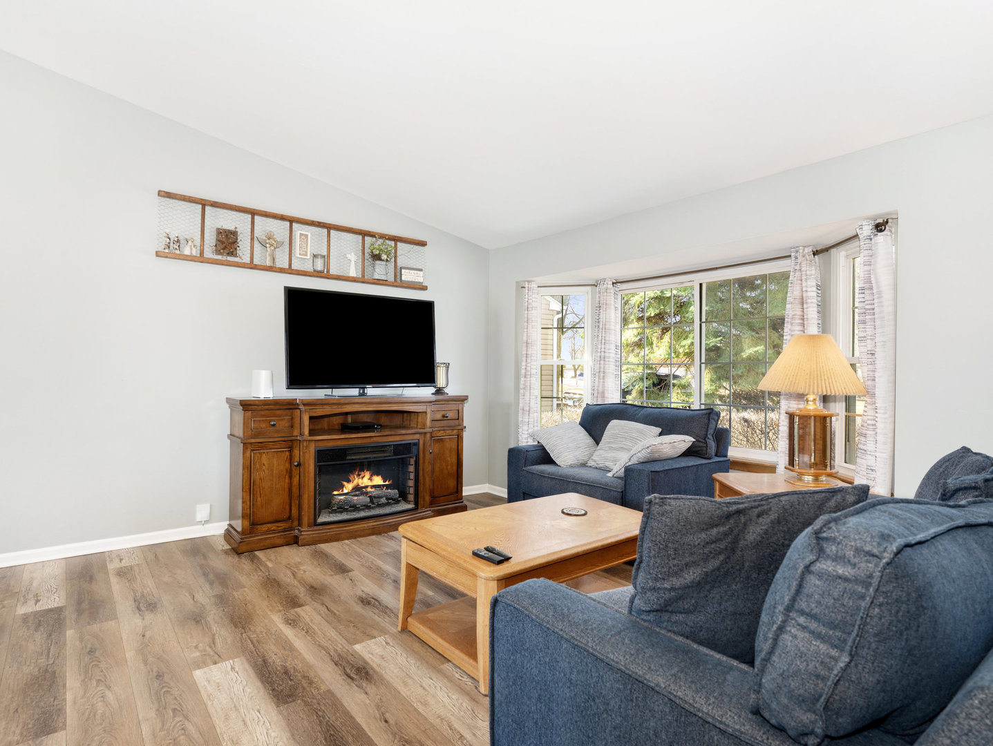 1400 Bar Harbour Road Aurora, IL 60504 - Photo 2 of 25 a living room with furniture and a flat screen tv