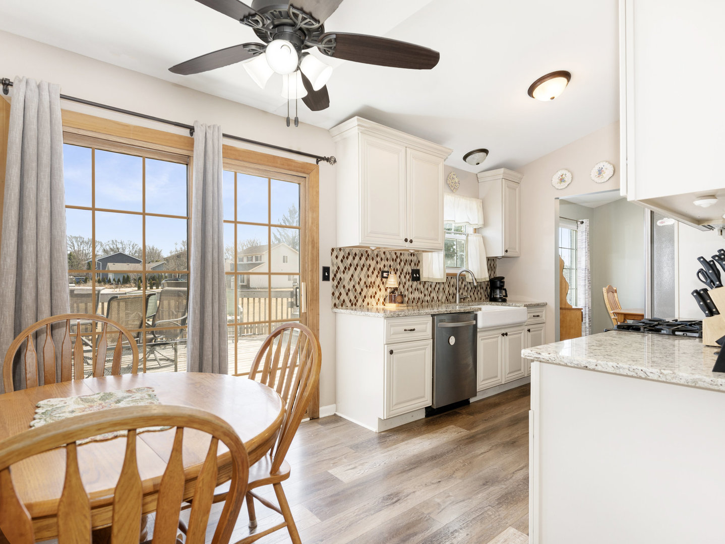 1400 Bar Harbour Road Aurora, IL 60504 - Photo 7 of 25 a kitchen with sink a refrigerator and chairs
