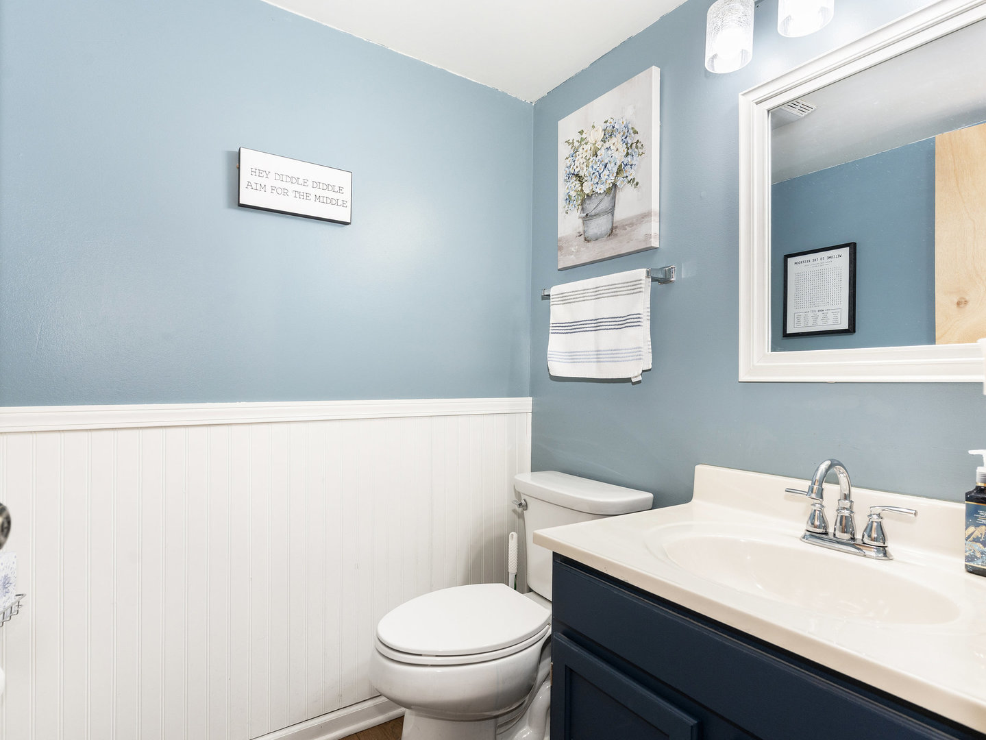 1400 Bar Harbour Road Aurora, IL 60504 - Photo 9 of 25 a bathroom with a toilet a sink and a mirror