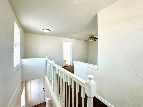 a view of an entryway with wooden floor
