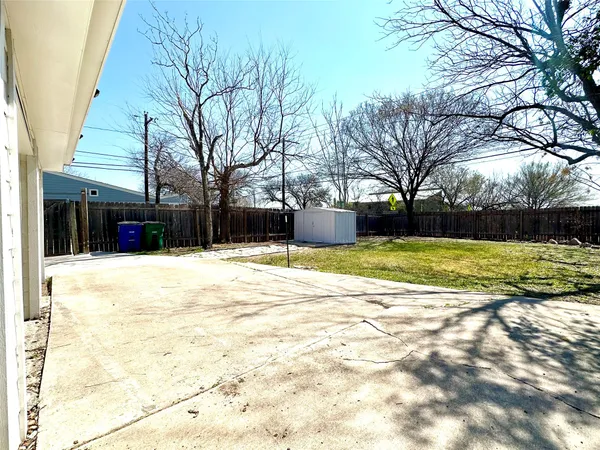 a view of a backyard of the house