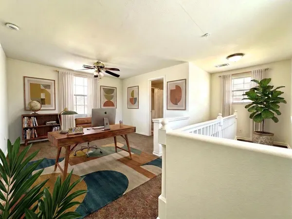 a living room with furniture and a table