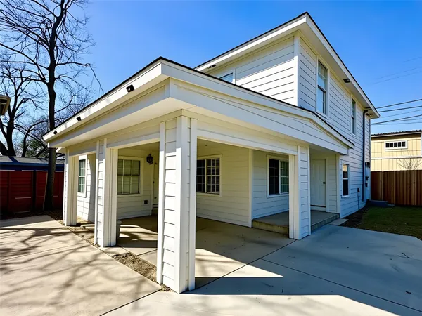 a view of a house with wooden floor and a yard