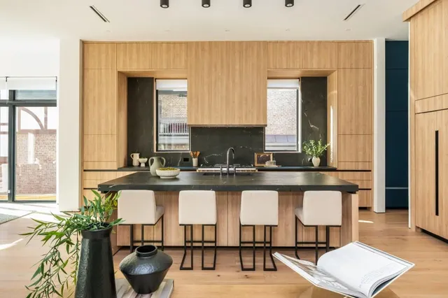 a kitchen with a table and chairs in it