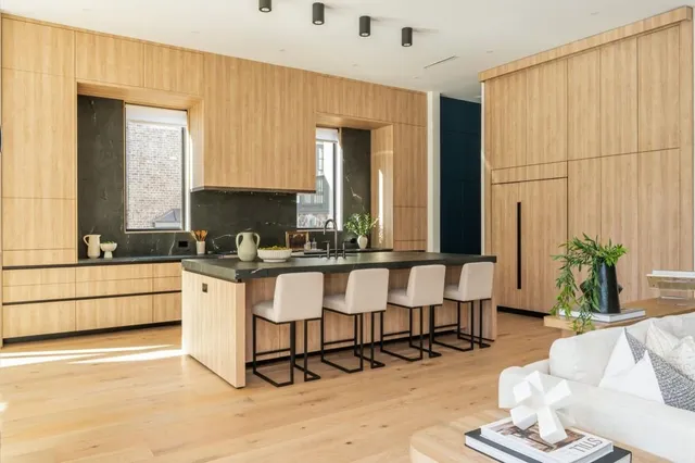 a living room with furniture and large windows