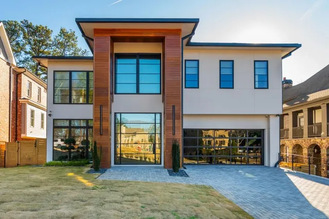 a view of an house with backyard and a fireplace
