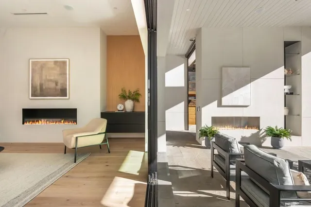 a balcony with view of couch and a potted plant