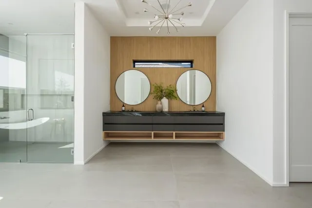 a bathroom with a toilet a sink and a mirror
