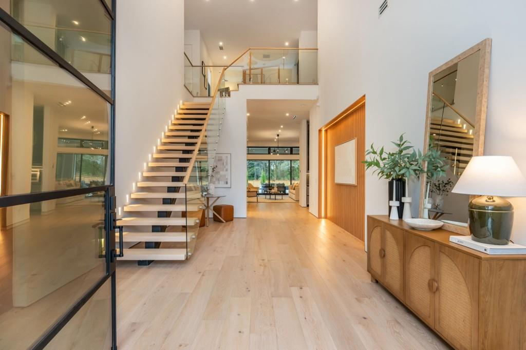 1127 Wimberly Road Northeast Atlanta, GA 30319 - Photo 5 of 37 a view of a room with wooden floor and stairs