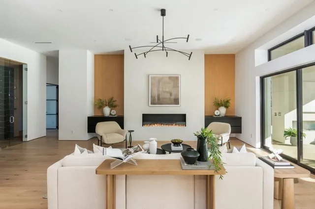 a room with a chandelier furniture and a chandelier