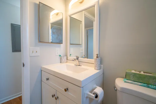 a bathroom with a sink vanity and a mirror