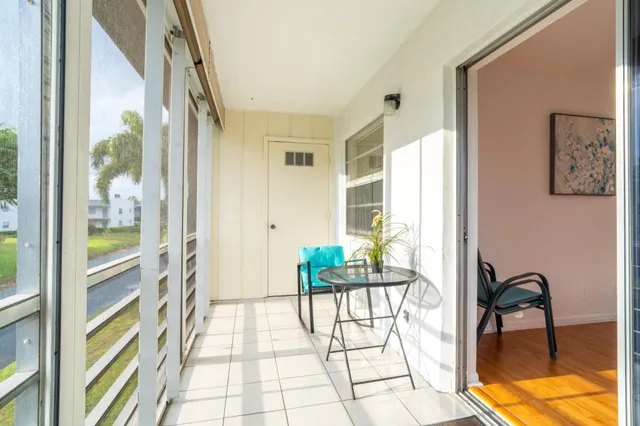 a view of a living room and a balcony