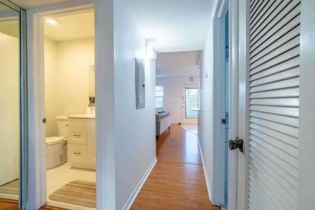 a view of a bathroom from a hallway
