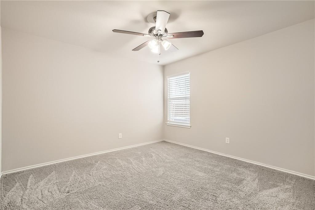 612 Copper Court Jarrell, TX 76537 - Photo 12 of 27 a view of a room with a ceiling fan and a window