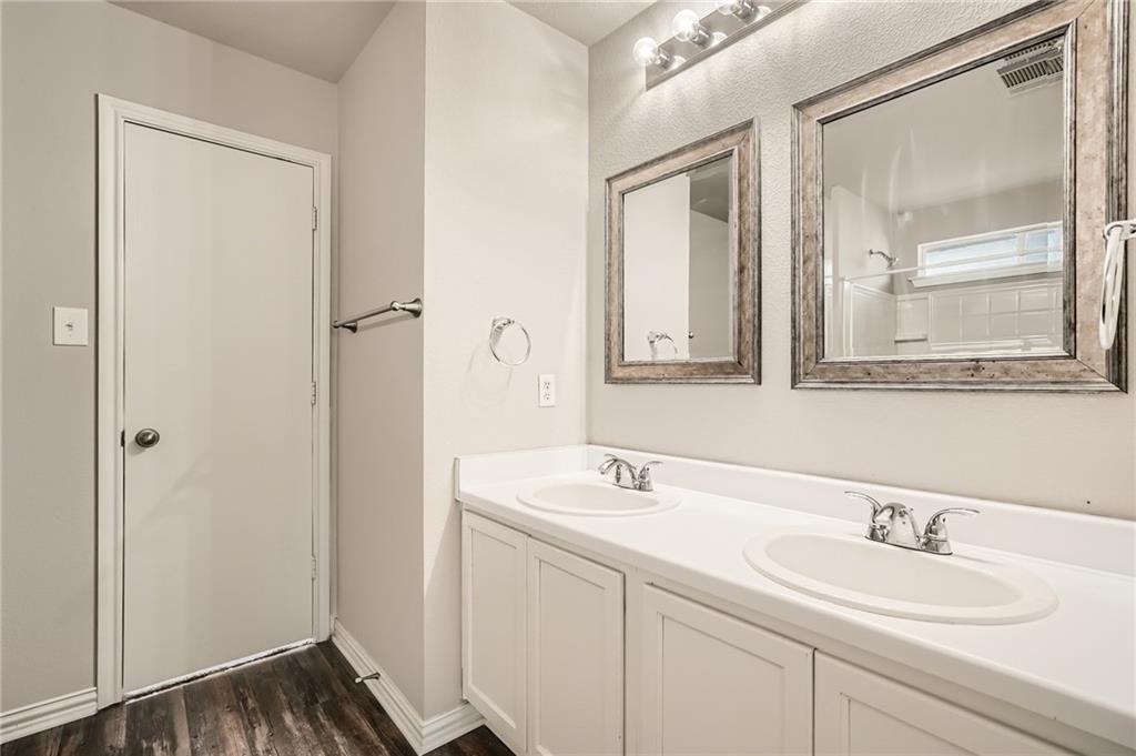 612 Copper Court Jarrell, TX 76537 - Photo 19 of 27 a bathroom with a sink and a mirror